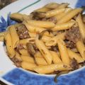 Penne con carciofi e salsiccia