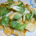 Gnocchi di patate con pomodorini, rucola e grana