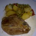 Agnello al forno con patate e piselli