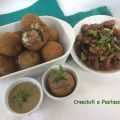 Arancine surprise con salsa di noci e basilico.[...]