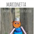 Marionetta con tappi e cannucce di plastica