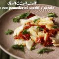 Baccalà saltato con pomodori secchi e rucola
